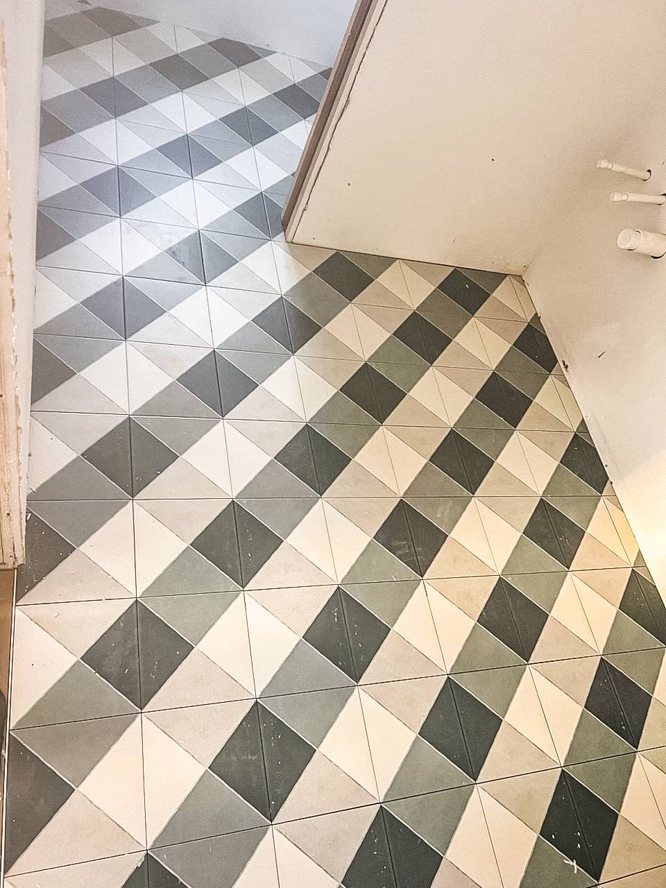 Floor tile installation subway pattern.