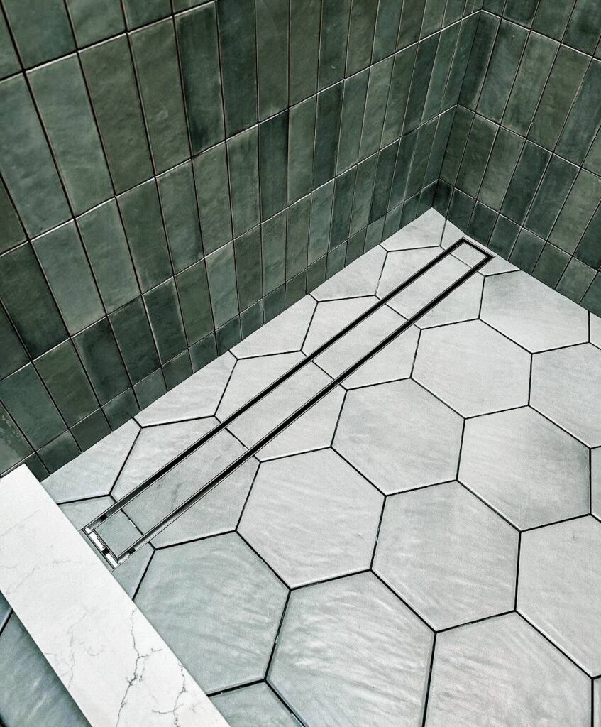 Finished shower tile with linear drain