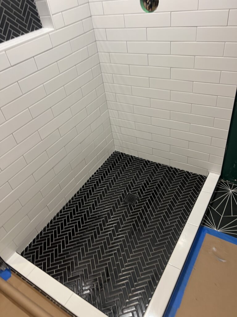 Finished bathroom with tiled shower
