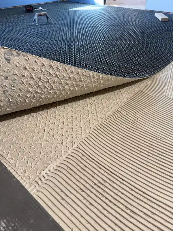 Checking thin-set mortar transfer under Ditra uncoupling membrane