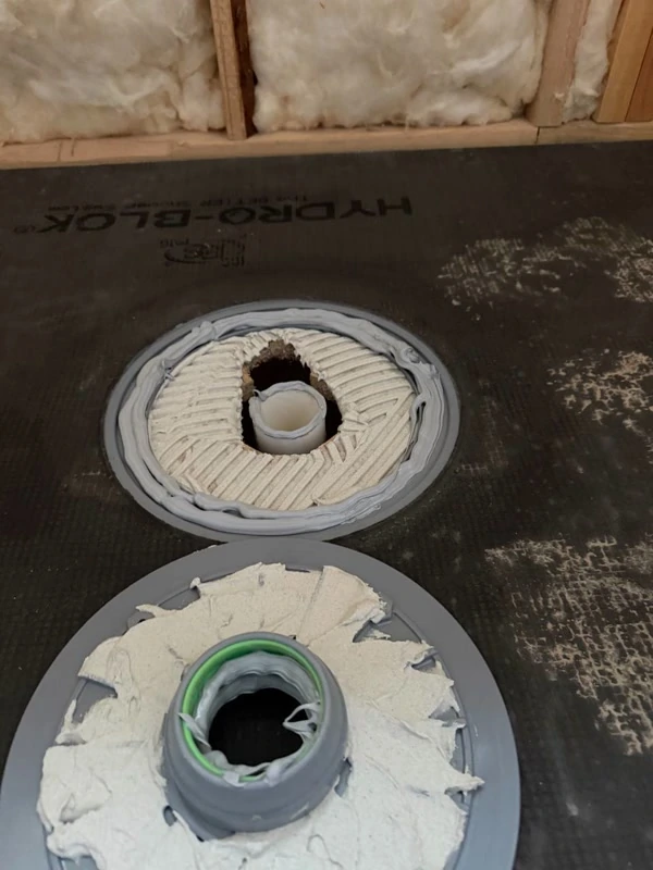 Shower drain flange set during pan install