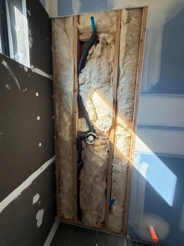 Shower valve rough-in with insulated supply lines in framed wall