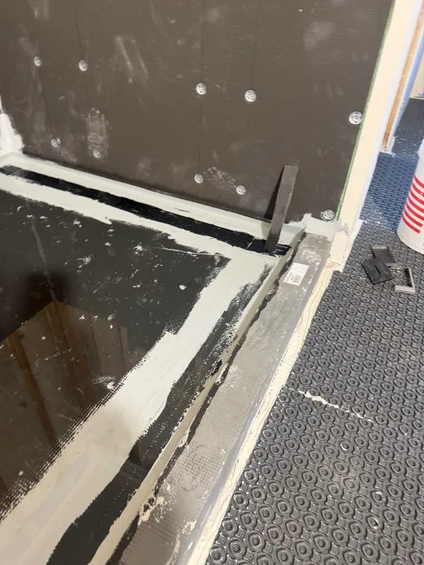 Shower curb and floor prep with a notched trowel