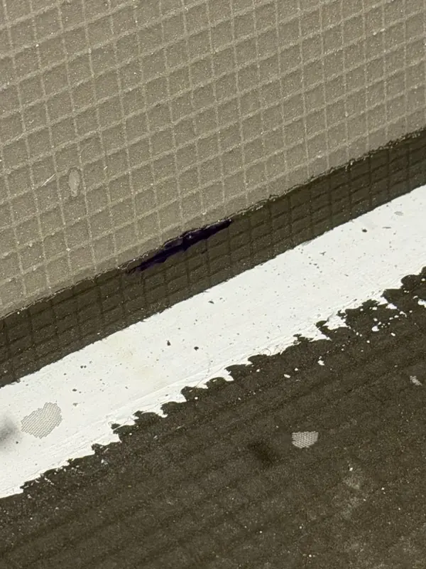 Wall-to-floor transition detail ahead of tile setting