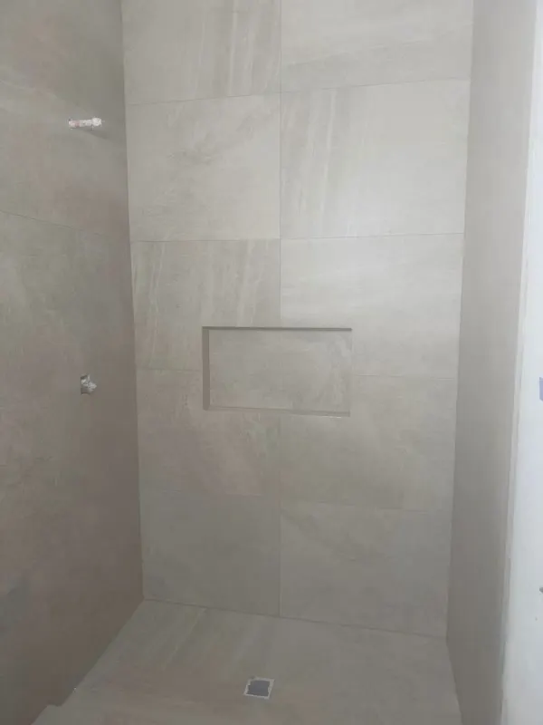 Tile leveling and wall set on a shower remodel in Issaquah