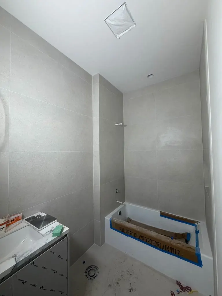 Walk-in shower tile walls during a remodel in Issaquah
