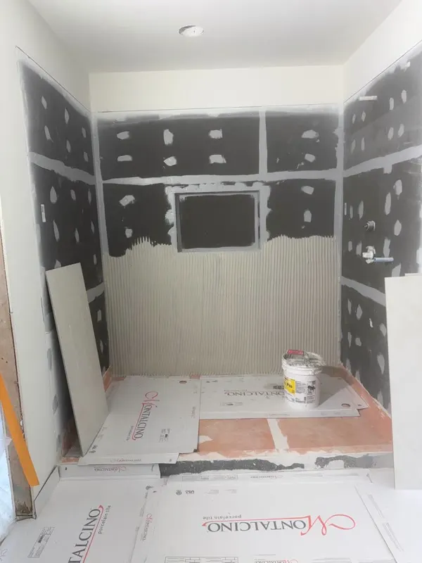 Bathroom remodel progress in Medina — tile layout and finish work