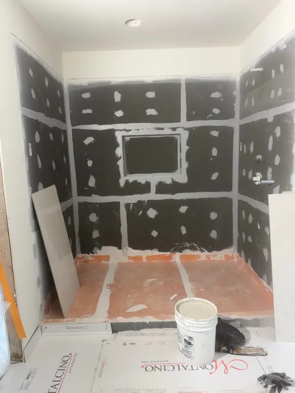 Shower tile install in progress for a bathroom remodel in Medina