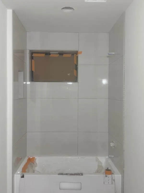 Large-format tile work during a bathroom remodel in Medina