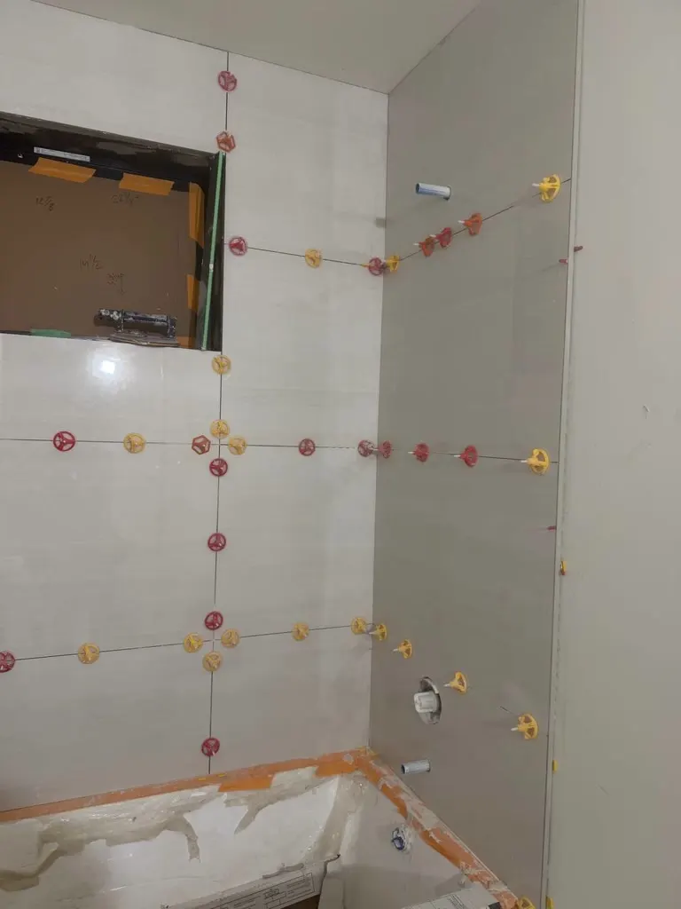 Bathroom floor tile install underway in Medina