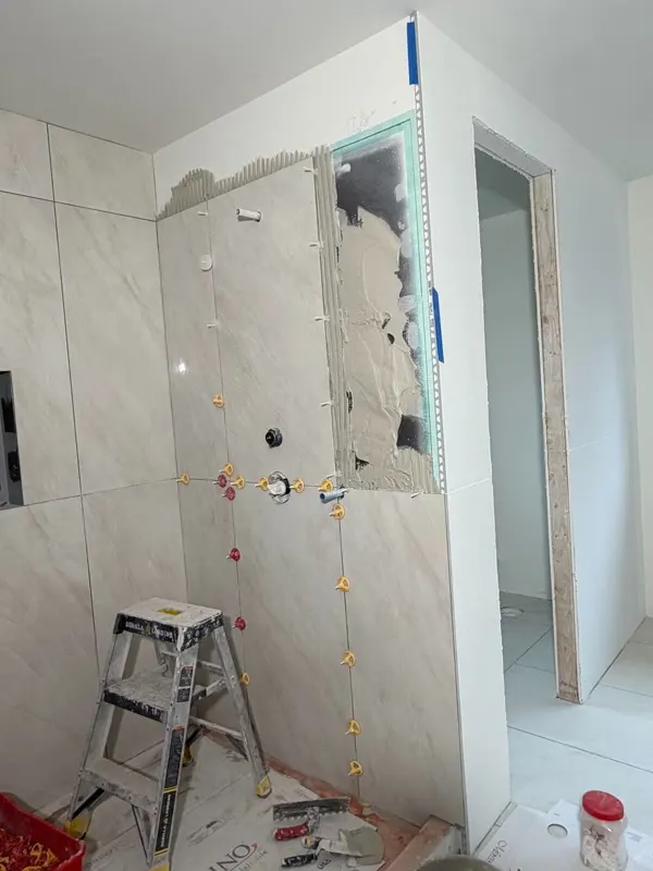 Tile leveling and wall set on a shower remodel in Mercer Island