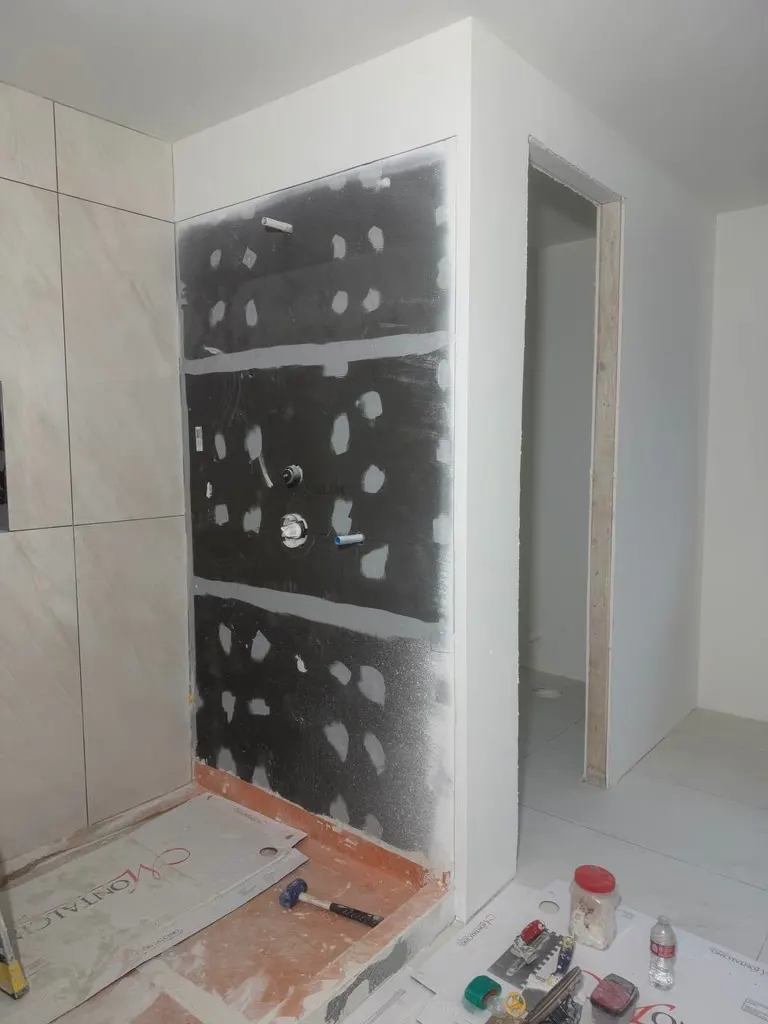 Walk-in shower tile walls during a remodel in Mercer Island
