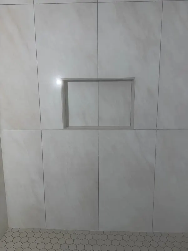 Large-format tile work during a bathroom remodel in Redmond