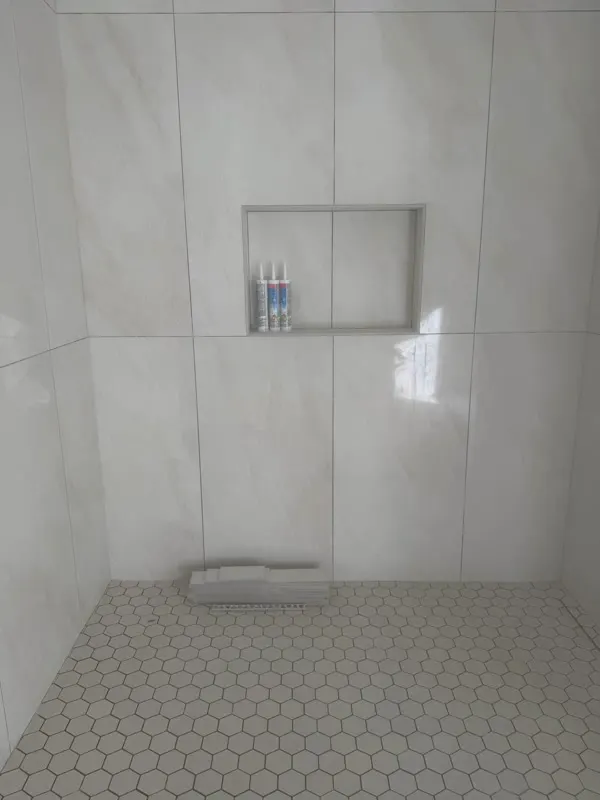 Tile leveling and wall set on a shower remodel in Redmond