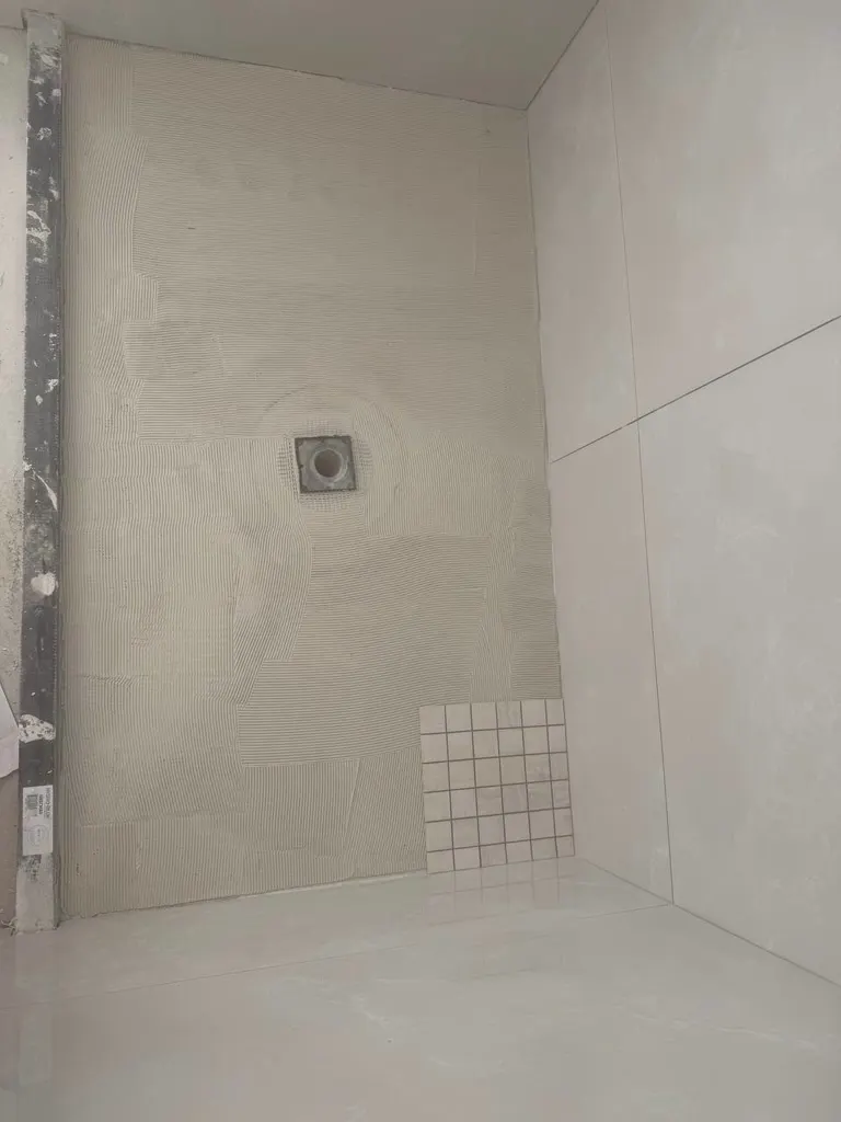 Bathroom floor tile install underway in Redmond