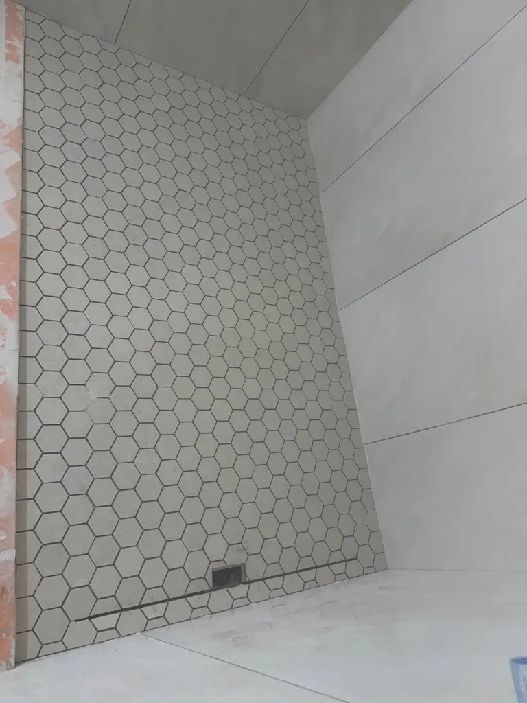 Walk-in shower tile walls during a remodel in Redmond