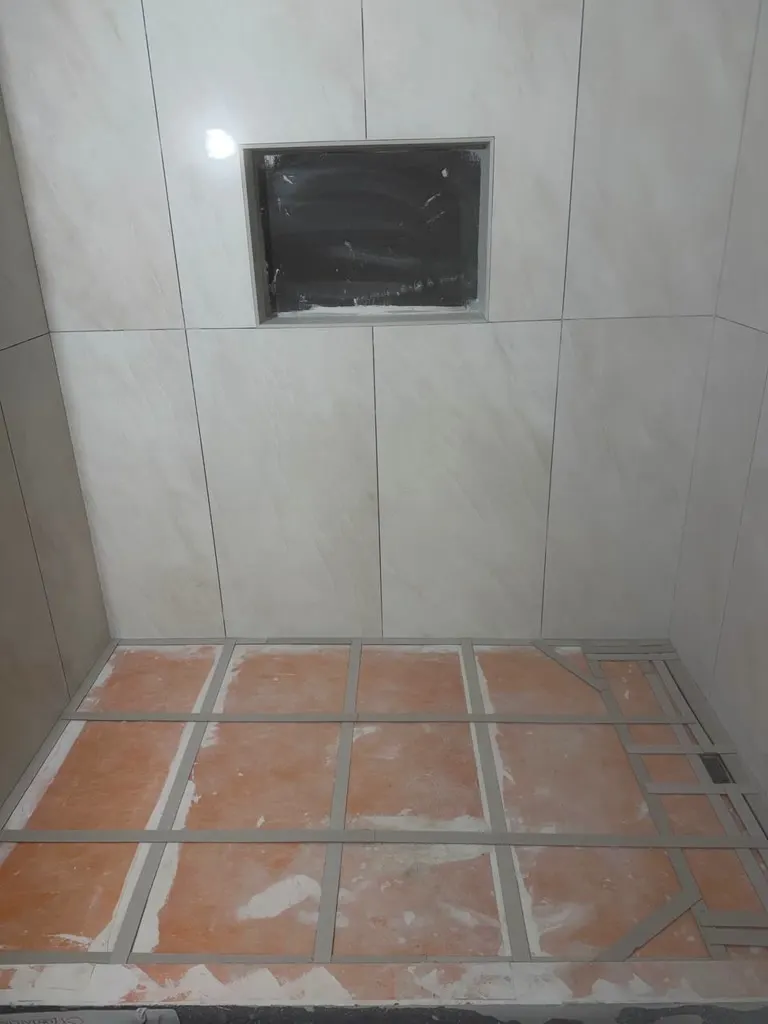 Finished-stage bathroom tile detail from a remodel in Redmond