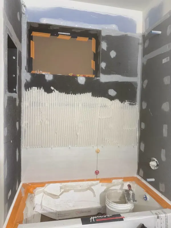 Tile leveling and wall set on a shower remodel in Snohomish