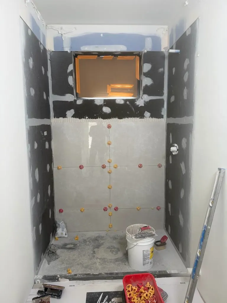Waterproofing and curb work before tile in Snohomish